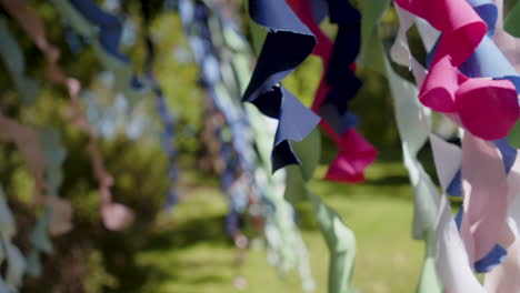 slowmotion shot of paper spiral decorations blowing in the wind