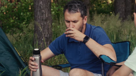 Family-camping-and-sitting-on-chairs