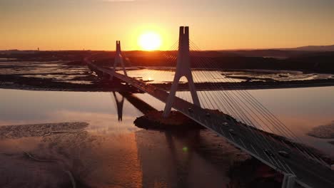 aerial view, locked down of bridge at the sunset