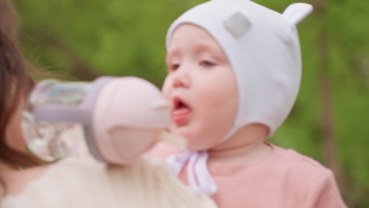 Women Care For Children Outdoors, Mothers And Women Calmly Care For Little Ones In Park Environment, Two Women And Mother Are Attentively Watching Over Their Babies In Peaceful Outdoor Setting