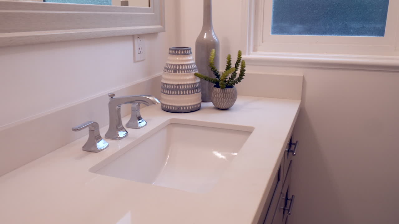 Slide right along a newly remodeled white bathroom vanity with sink and interior decor