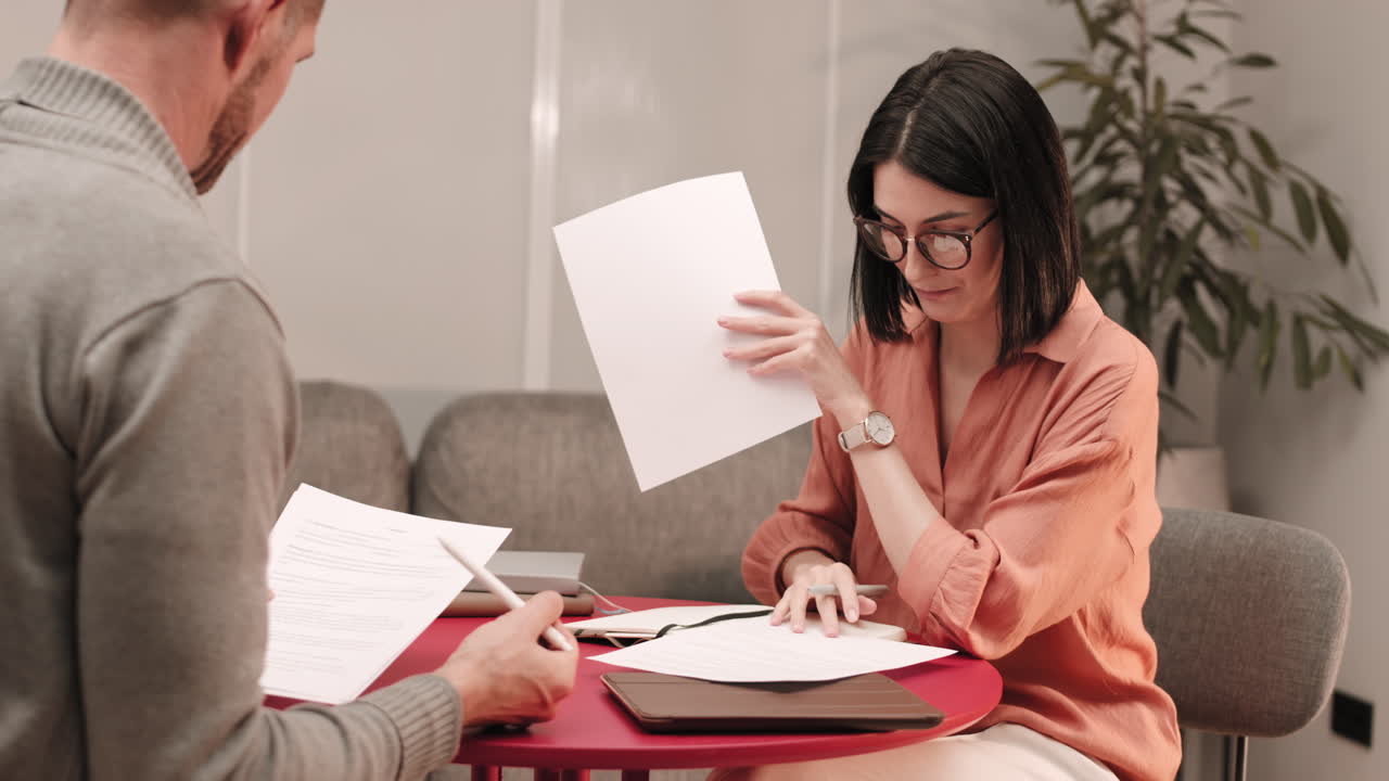 Couple Calculating Taxes at Home