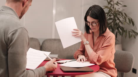 couple calculating taxes at home