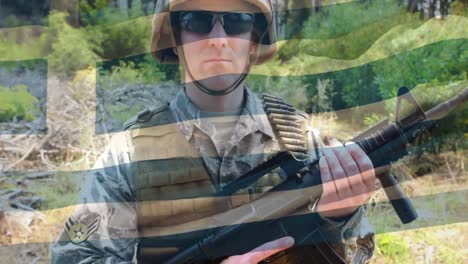 Digital-composition-of-waving-greece-flag-against-soldier-holding-a-gun-at-training-camp