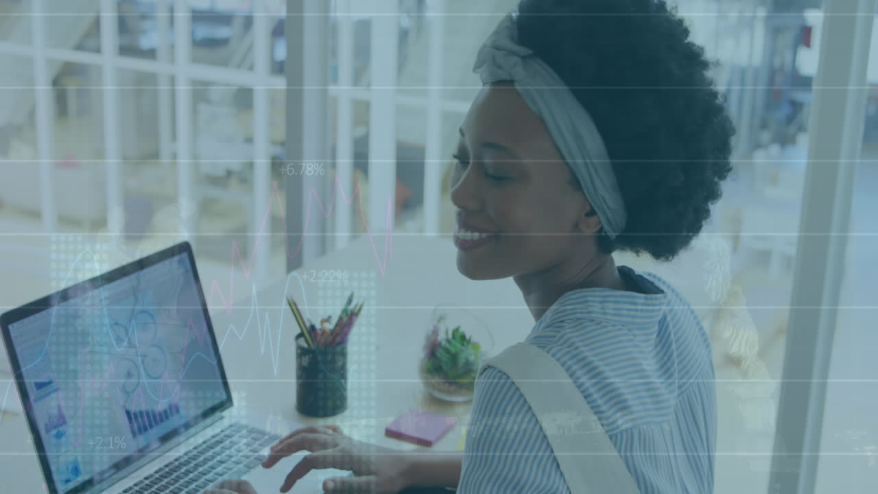 Animation of financial data processing over biracial businesswoman in office