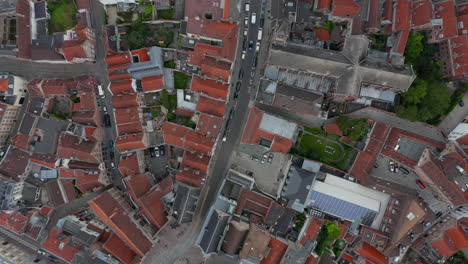 Birds-View-of-European-Town-with-Red-Rooftops-and-little-traffic-and-empty-streets-during-Coronavirus-Pandemic-Lockdown