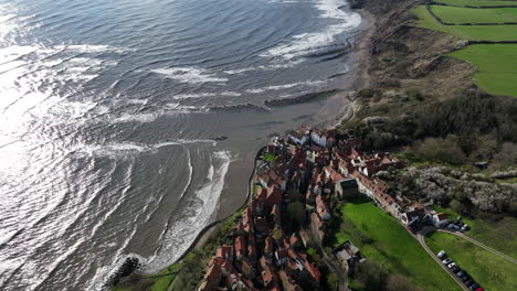 robin hoods bay - flight backwards from lower town elevation to reveal - prores 4k april 2023