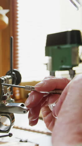 horologist using a machine