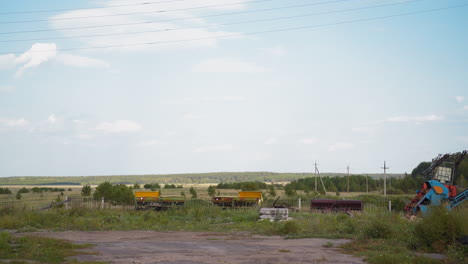 farm machinery and equipment on meadow grass at countryside