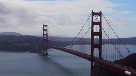 san francisco golden gate bridge aerial drone california horseshoe bay area point cavallo needles rock dana bowers vista point grey cloudy mist misty fog skies sausalito cars traffic backwards motion