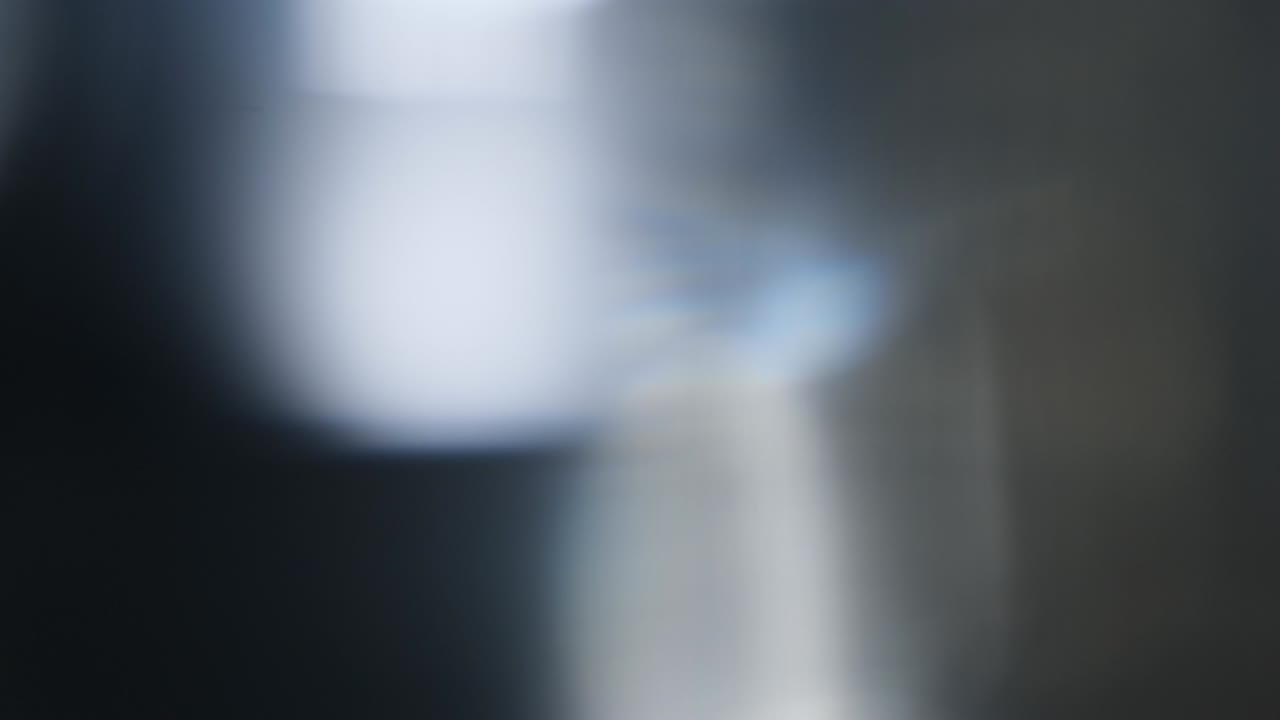 Abstract light leaks on black background.