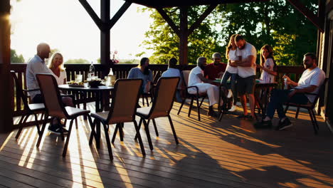 friends enjoying a happy outdoor gathering at sunset