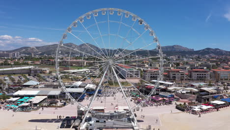 big wheel amusement park marseille france aerial fix shot sunny day blue sky