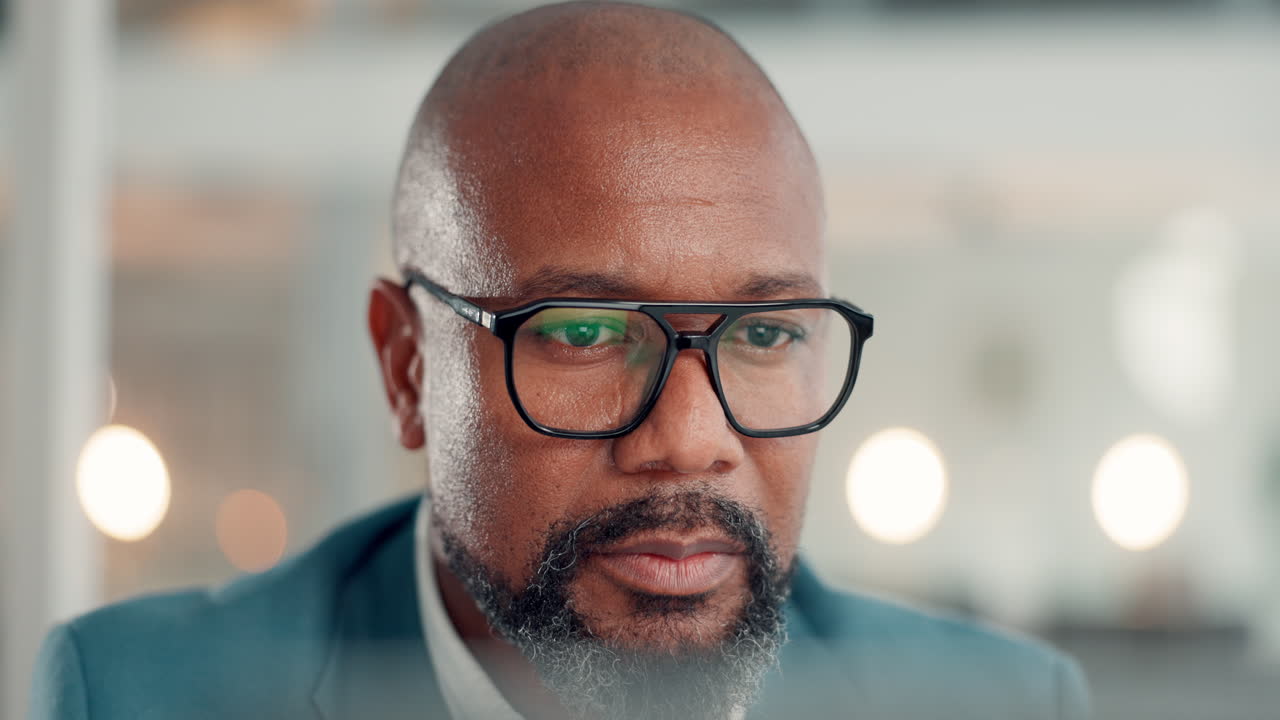 Close-up portrait of a serious businessman wearing glasses