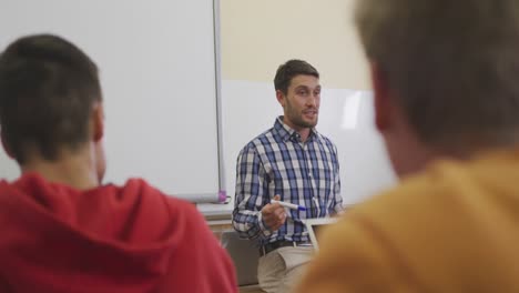 teacher talking at his high school class