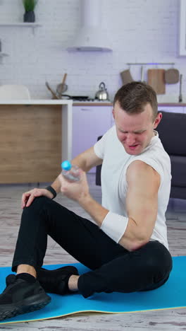 sport exercises at home. a man uses household items for sport exercises. vertical video
