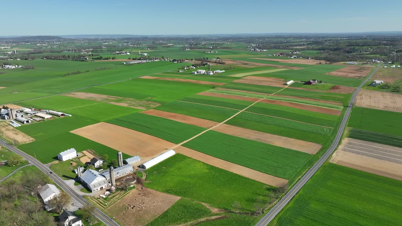 Different colored farm fields with cultivation during Sunny day in spring
