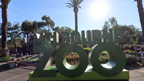 entrance sign of melbourne zoo under bright sunlight