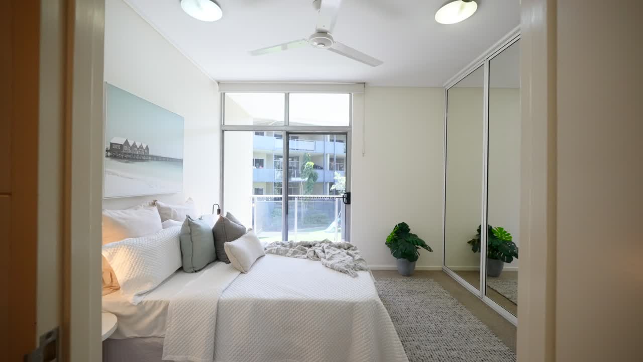 Minimalist bedroom interior with natural lighting and sleek furnishings in a lofi style modern home. Interior of house home staged for real estate.