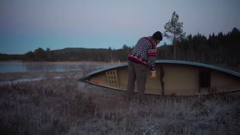 a man is checking his boat - static shot