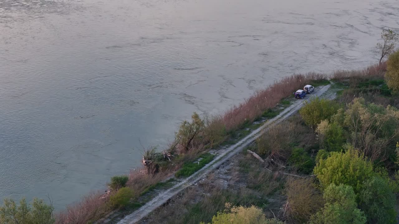 Tranquil Waters to Urban Silhouette: The Po’s gentle dawn serenity flows toward Cremona’s skyline, blending peaceful nature with the vibrancy of city life