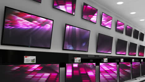 interior of electronics store with synchronized video playing on screens of multiple televisions