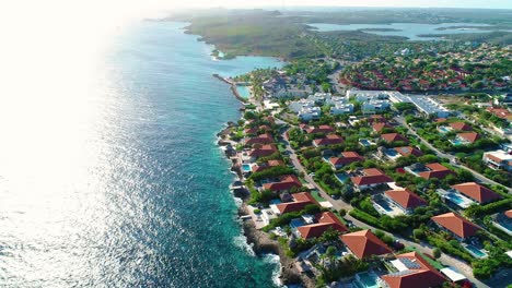 drone dolly tilt up along curacao coastline near zanzibar beach and vista royal neighborhood