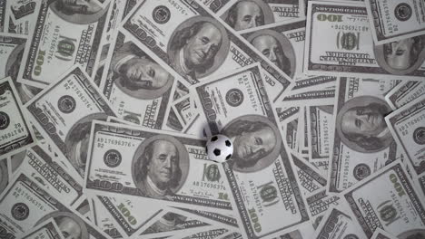 soccer ball and dollars