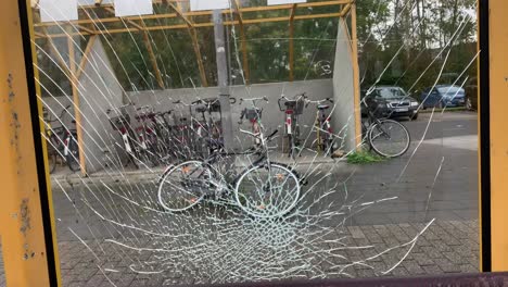 broken window glass at bus stop, close up