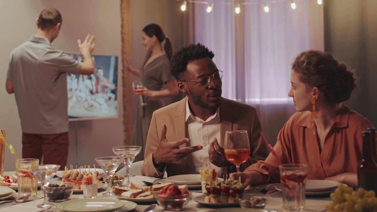 Couple of Friends Talking during Virtual Dinner Party