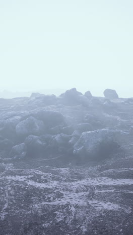 a misty, rocky desert landscape on an alien planet