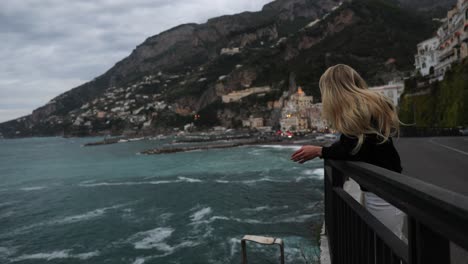 wanderlust, blonde female tourist traveling and admiring beautiful amalfi coast, italy