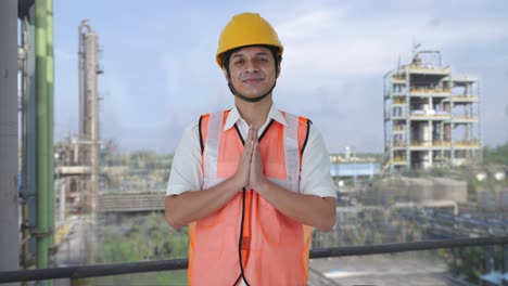 happy indian architect doing namaste