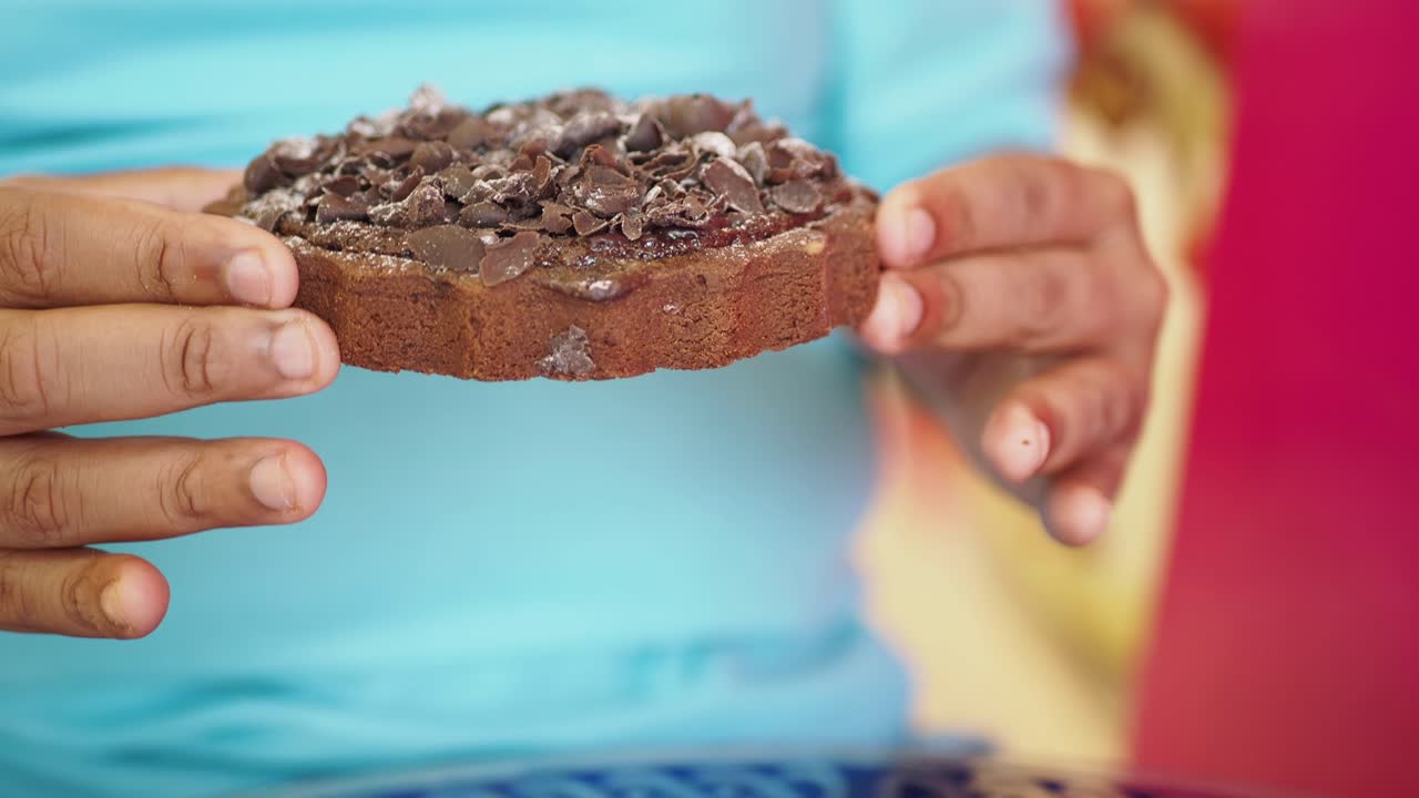 Person holding a delicious chocolate tart
