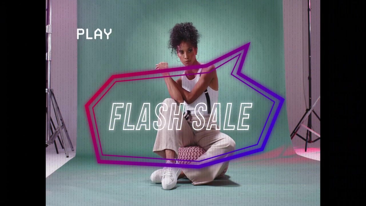 Neon overlay appearing, adult woman shifting poses and adjusting strap, promoting FLASH SALE
