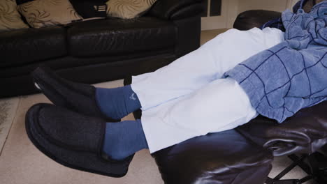 man relaxing on couch