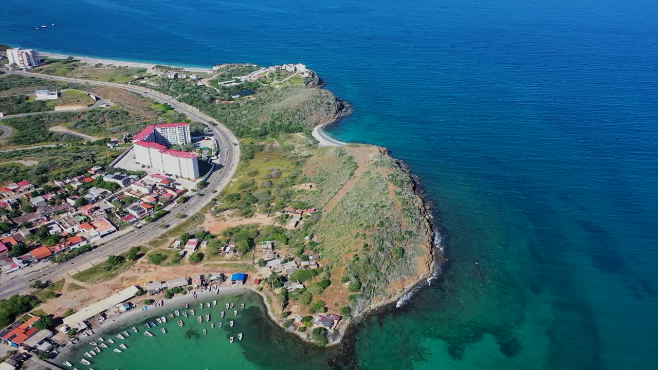 Drone views of Playa Moreno's coast and rural life, with docks and boats