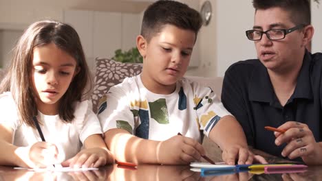 kids and mother doing crafts at home