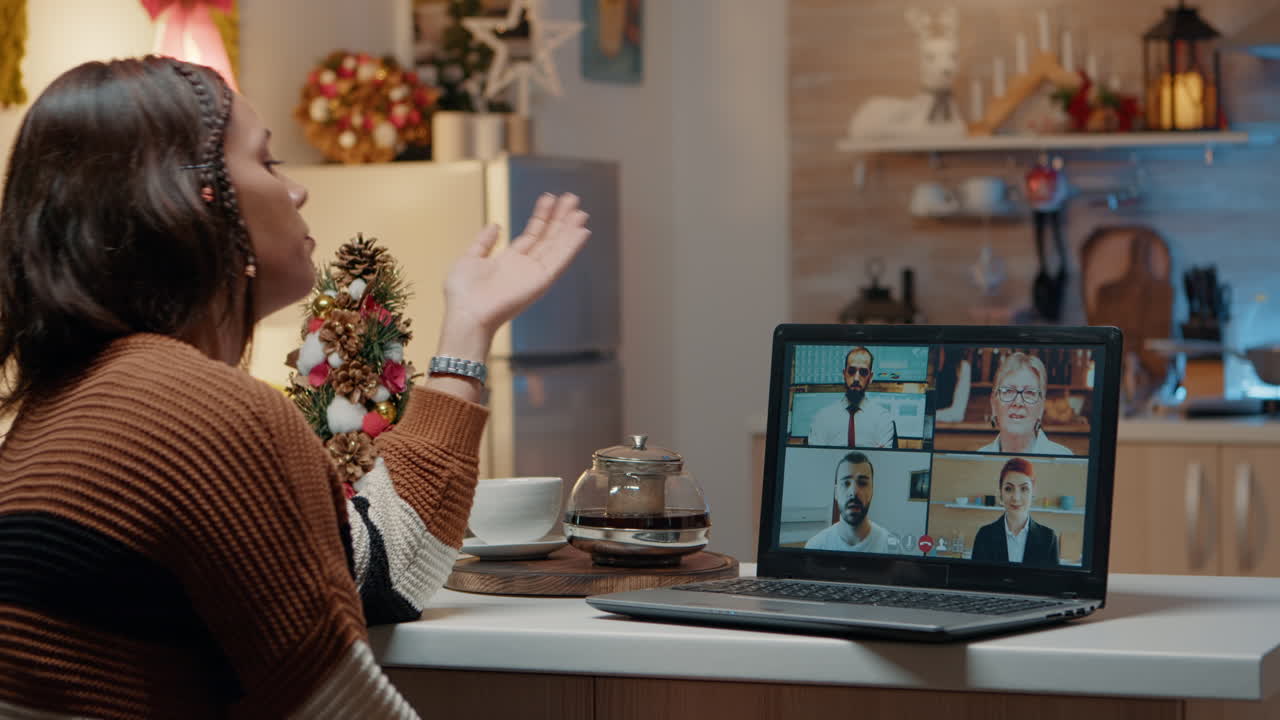 Young adult using laptop for work video call