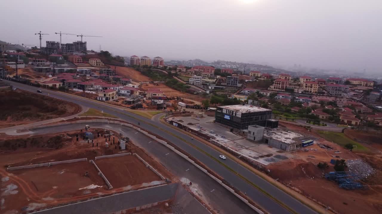 Drone flying towards a building under construction in the outskirts of Abuja, the capital city of Nigeria, Africa