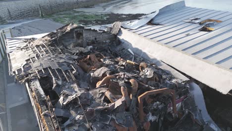 Close-aerial-footage-of-fire-damaged-restaurant-showing-extent-of-damage