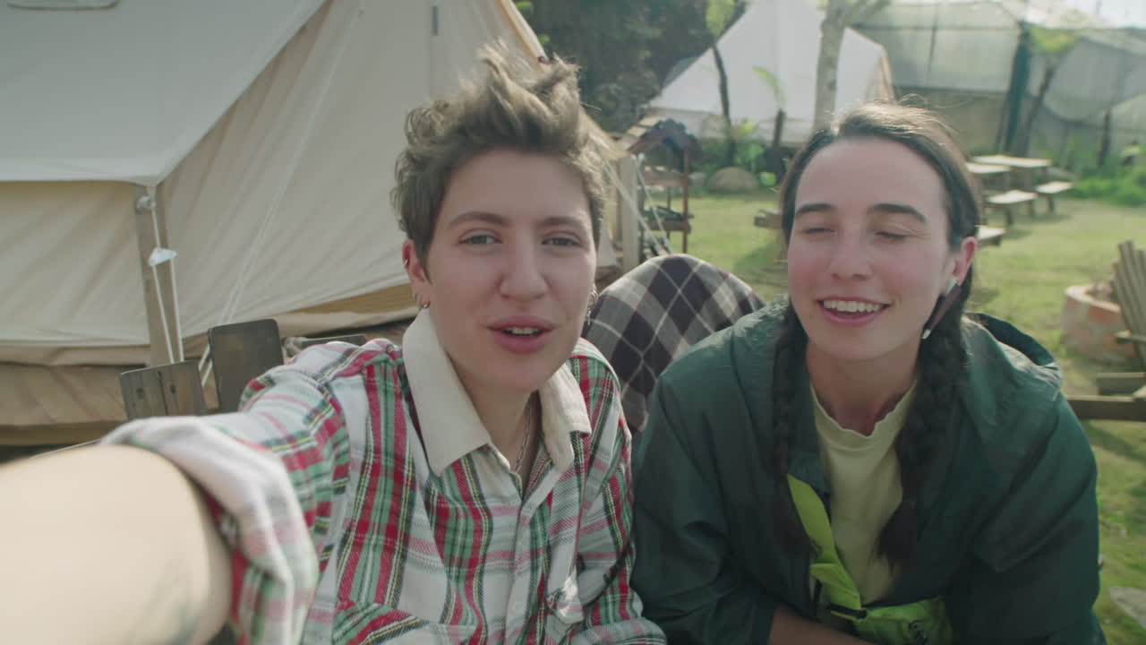 POV of Female Tourists Video Calling at Glampsite