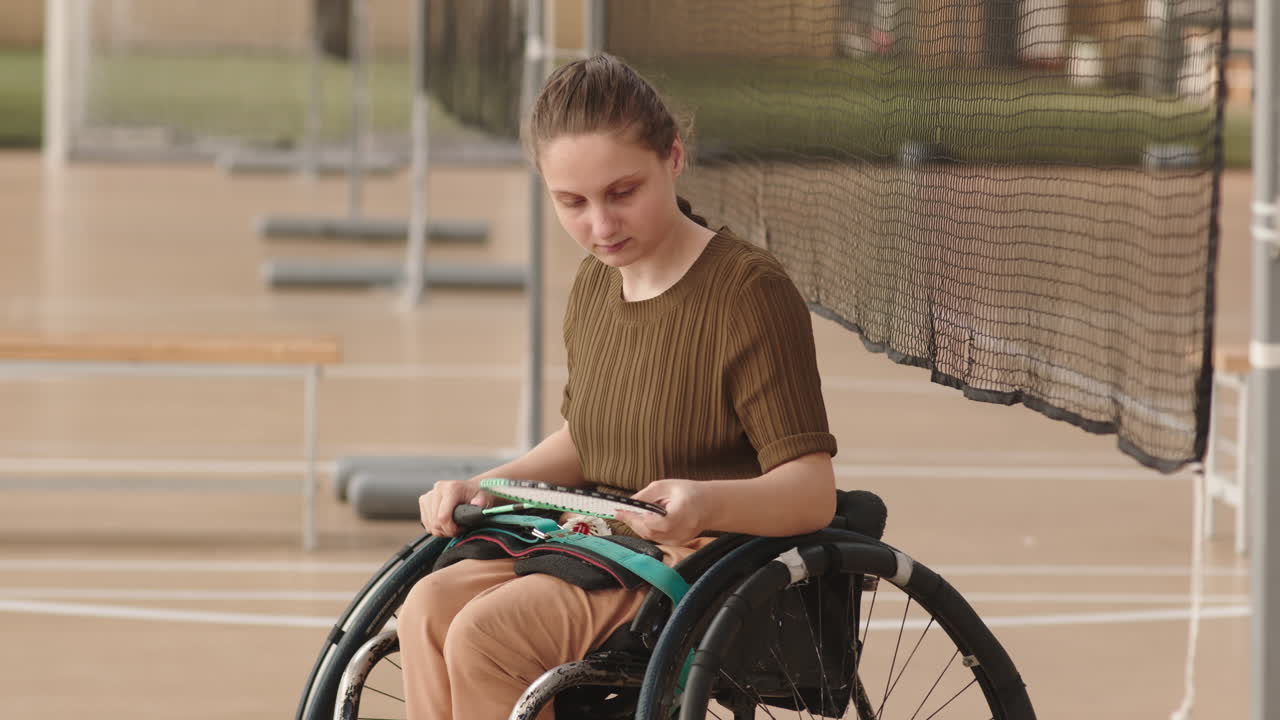 Female Badminton Athlete in Wheelchair Posing