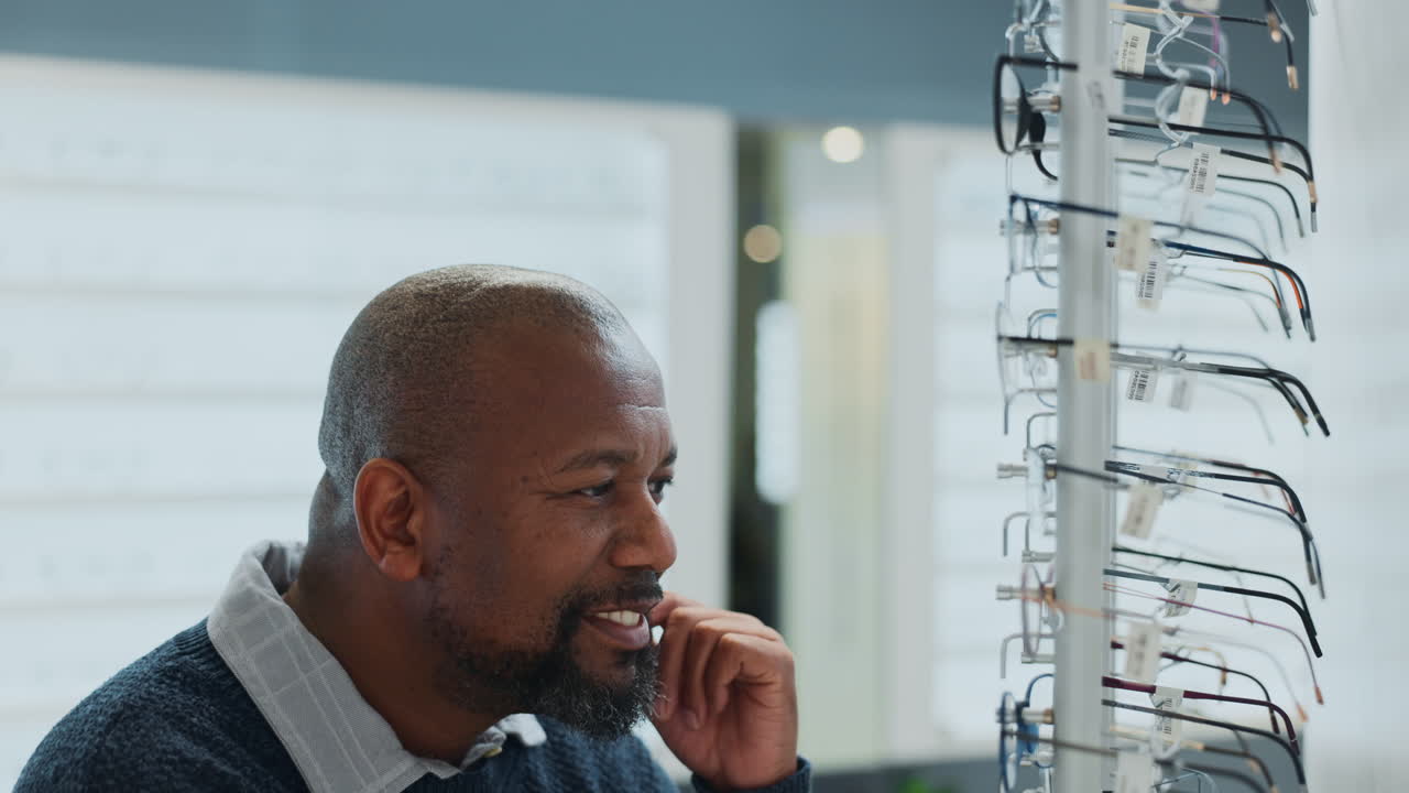 Man Choosing Eyeglasses at an Optometrist