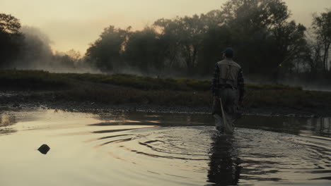 fisherman in the misty morning