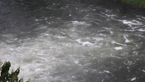 Kaeng Krachan National Park Dam with Swirling Water in a River with Slight Mist in Thailand