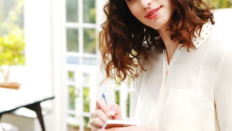 Waitress-taking-order-in-restaurant