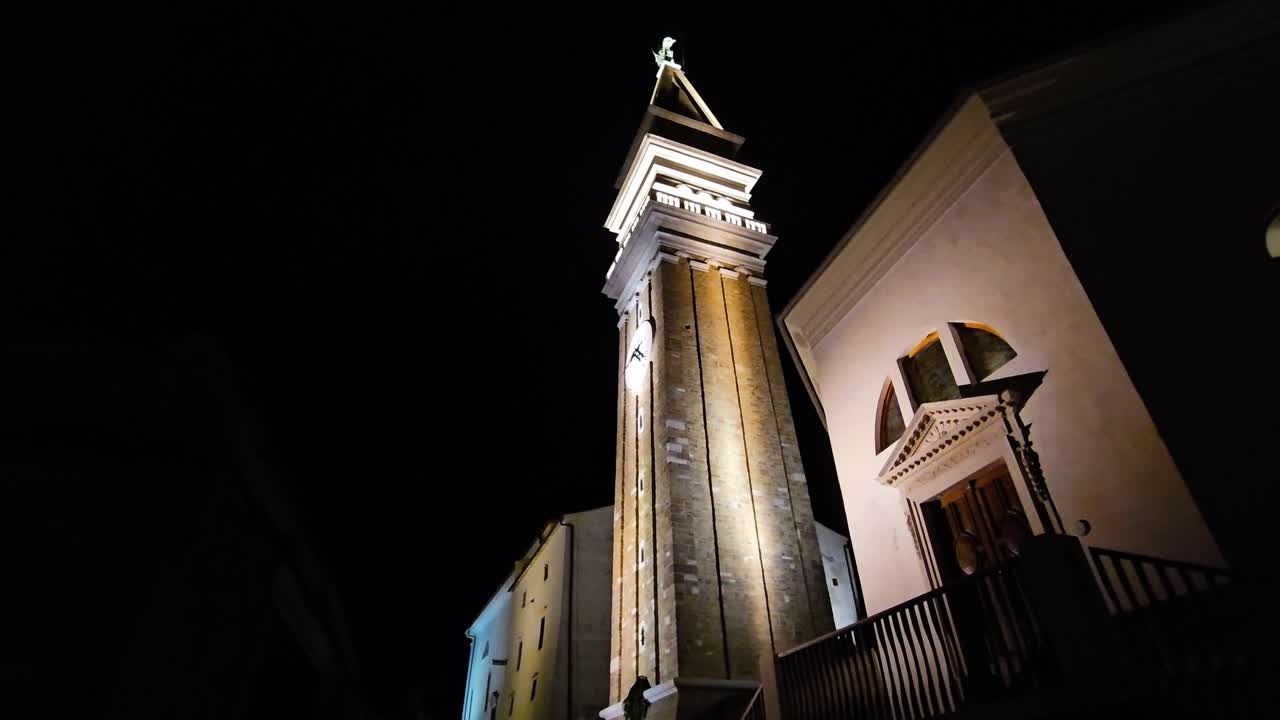 Slow motion night scene featuring St. George's Church in Piran, Slovenia