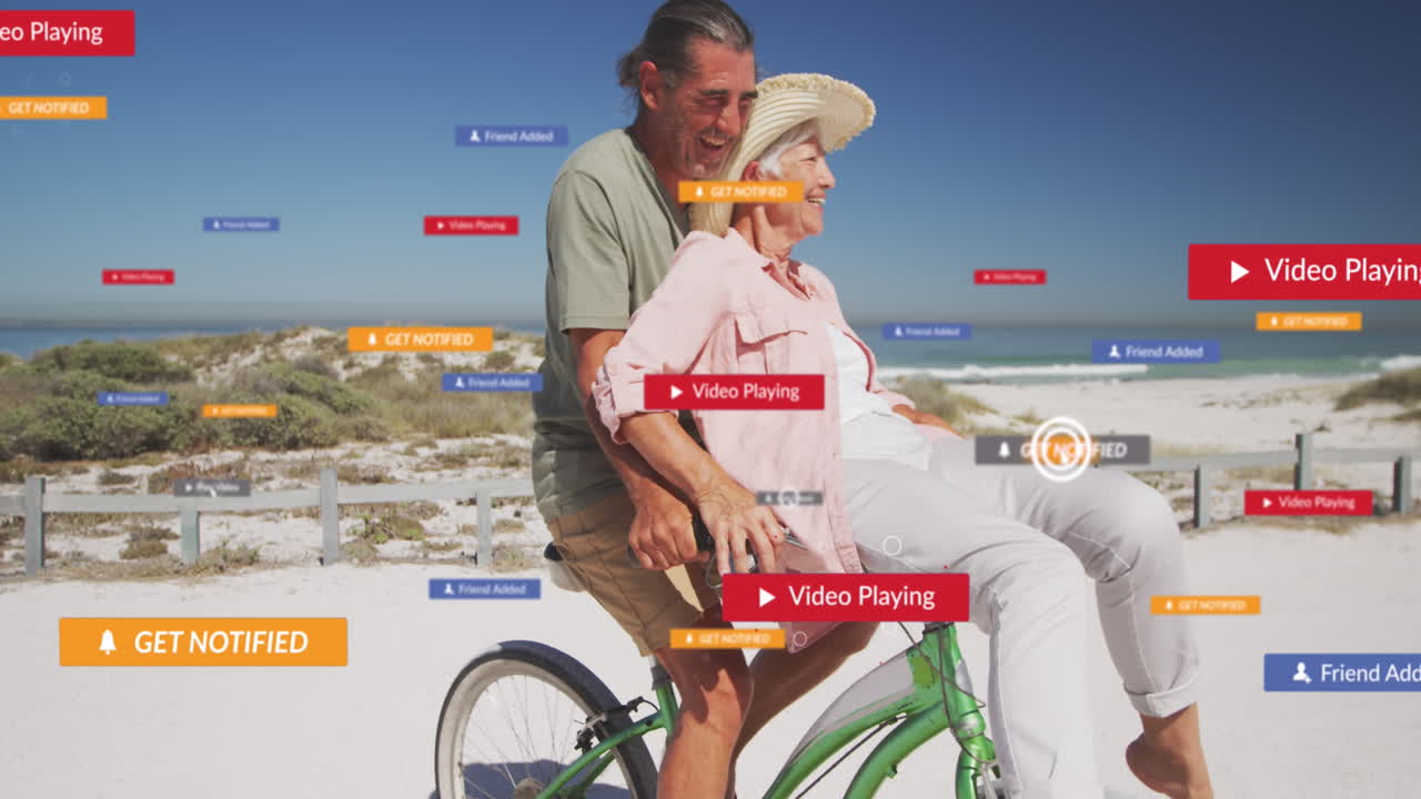animación de texto e iconos de redes sociales sobre una pareja caucásica montando bicicleta en la playa