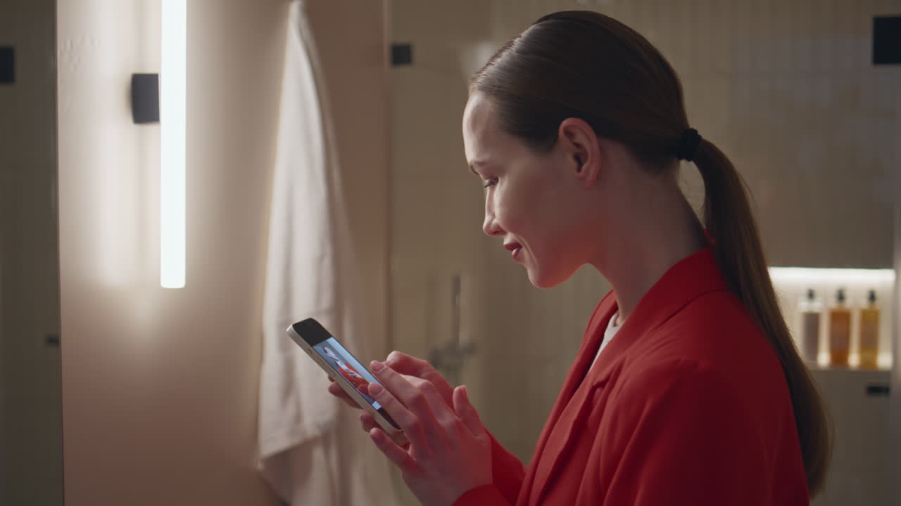 Attractive woman making photo in mirror reflection closeup. Smiling lady message